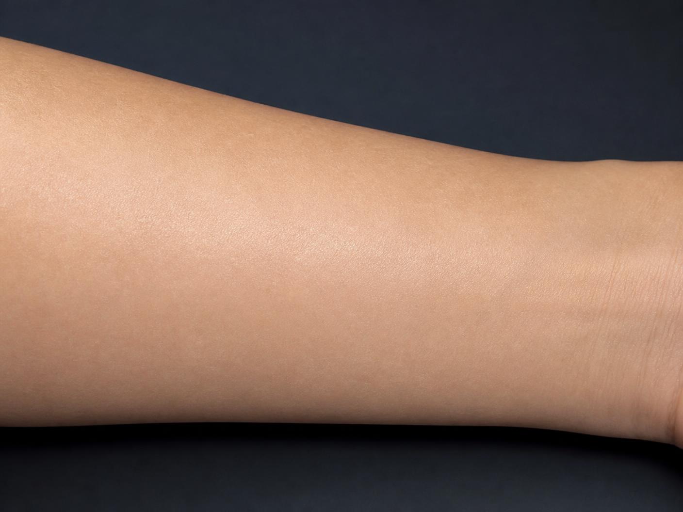 Reference photograph of a forearm with calm, smooth, evenly hydrated skin